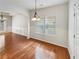 Traditional dining room features wood floors, wainscoting, and contemporary light fixture at 2470 Arnold Mill Rd, Lawrenceville, GA 30044