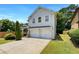 Well-maintained home with manicured lawn, two-car garage, and lovely landscaping at 2470 Arnold Mill Rd, Lawrenceville, GA 30044