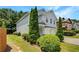 Attractive home with a two-car garage, green lawn, and tasteful landscaping at 2470 Arnold Mill Rd, Lawrenceville, GA 30044