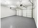 This well-lit garage boasts epoxy flooring and plenty of room for two vehicles at 2470 Arnold Mill Rd, Lawrenceville, GA 30044