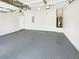 Spacious garage featuring epoxy flooring, ample lighting, and a clean, organized layout at 2470 Arnold Mill Rd, Lawrenceville, GA 30044