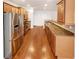 Kitchen with stainless steel appliances, breakfast bar, and hardwood floors at 2470 Arnold Mill Rd, Lawrenceville, GA 30044