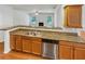 Modern kitchen with stainless steel appliances and breakfast bar overlooking the living room at 2470 Arnold Mill Rd, Lawrenceville, GA 30044