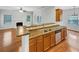 Open concept kitchen featuring stainless steel appliances and a breakfast bar at 2470 Arnold Mill Rd, Lawrenceville, GA 30044
