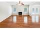 Bright living room with hardwood floors, fireplace, and plenty of natural light at 2470 Arnold Mill Rd, Lawrenceville, GA 30044