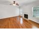 Spacious living room with hardwood floors, fireplace, and abundant natural light at 2470 Arnold Mill Rd, Lawrenceville, GA 30044