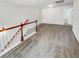 Upstairs loft area features neutral carpet, white walls, and wood railing at 2470 Arnold Mill Rd, Lawrenceville, GA 30044