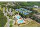 Gorgeous aerial view of community pool, tennis courts, playground, and clubhouse at 7048 Bennington Ln, Cumming, GA 30041