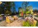 A relaxing backyard deck with a cozy outdoor lounge area, outdoor seating and a grill at 7048 Bennington Ln, Cumming, GA 30041