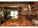 Well-equipped bar area featuring brick walls, unique bottle cap countertop, and a traditional draft system at 7048 Bennington Ln, Cumming, GA 30041