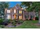 Beautiful two-story brick home with a manicured front yard and inviting curb appeal at 7048 Bennington Ln, Cumming, GA 30041