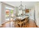 Well-appointed kitchen with a central island and a view of the deck at 7048 Bennington Ln, Cumming, GA 30041