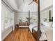 Spacious primary bedroom featuring hardwood floors, and natural light at 7048 Bennington Ln, Cumming, GA 30041