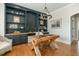 Bright office space showcasing custom built-ins, hardwood floors, and a unique desk at 7048 Bennington Ln, Cumming, GA 30041