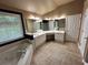 Bathroom features double vanity, tub, standing shower and tile flooring at 1038 Island View Ct, Buford, GA 30518