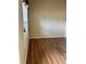 Bright bedroom with warm hardwood flooring, neutral paint, and natural light at 1038 Island View Ct, Buford, GA 30518