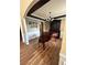 Elegant dining room showcasing hardwood floors, wainscoting, and a stylish chandelier at 1038 Island View Ct, Buford, GA 30518