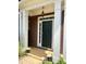Inviting front door with decorative columns and an overhead light fixture at 1038 Island View Ct, Buford, GA 30518