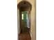 Hallway with hardwood floors leading to a room with natural light at 1038 Island View Ct, Buford, GA 30518