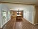 Spacious kitchen featuring hardwood floors, an island, and modern appliances at 1038 Island View Ct, Buford, GA 30518