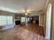 Open-concept living room featuring hardwood floors, a fireplace, and ample natural light at 1038 Island View Ct, Buford, GA 30518