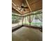 A covered patio with a ceiling fan and views of the private backyard at 1038 Island View Ct, Buford, GA 30518