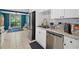 Bright kitchen featuring stainless steel appliances and white cabinets at 5360 Fieldgreen Dr, Stone Mountain, GA 30088