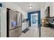 Bright kitchen with stainless steel appliances and white cabinets at 5360 Fieldgreen Dr, Stone Mountain, GA 30088