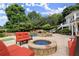 Scenic backyard featuring a pool, hot tub, fire pit, and ample seating area at 6325 Haddington Ln, Suwanee, GA 30024