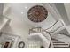 Spectacular foyer ceiling with decorative dome, curved staircase and wainscoting details at 6325 Haddington Ln, Suwanee, GA 30024