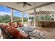 Well-appointed outdoor kitchen with grill, counter space, and comfortable seating area at 6325 Haddington Ln, Suwanee, GA 30024