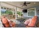 Covered patio featuring an outdoor kitchen, comfortable seating and a ceiling fan at 6325 Haddington Ln, Suwanee, GA 30024