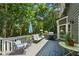 Inviting back deck with outdoor seating, grill, and scenic view at 1518 Maplewood Ct, Woodstock, GA 30189
