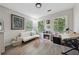 Cozy bedroom with corner fireplace, decorative touches, and ample natural light at 1518 Maplewood Ct, Woodstock, GA 30189