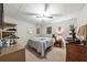 Cozy bedroom with a comfortable bed and ceiling fan at 1518 Maplewood Ct, Woodstock, GA 30189