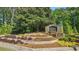 Beautiful entrance to the Eagle Watch community with stone signage at 1518 Maplewood Ct, Woodstock, GA 30189