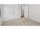 Spacious bedroom featuring neutral walls, carpeting, and walk-in closet for storage at 175 Basil St, Cumming, GA 30040