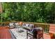 Inviting outdoor deck furnished with cozy seating and a serene forest view, great for entertaining guests at 410 Waterridge Ct, Sandy Springs, GA 30350