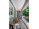 Cozy balcony featuring seating and views of the surrounding greenery and trees at 410 Waterridge Ct, Sandy Springs, GA 30350