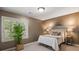 Serene bedroom with plantation shutters offering ample natural light at 410 Waterridge Ct, Sandy Springs, GA 30350
