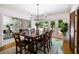 Elegant dining room with hardwood floors, chandelier, and backyard view at 410 Waterridge Ct, Sandy Springs, GA 30350