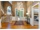 Grand foyer with hardwood floors, staircase, and view into the living room at 410 Waterridge Ct, Sandy Springs, GA 30350