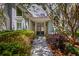 Inviting front entrance featuring a double door framed by lush landscaping at 410 Waterridge Ct, Sandy Springs, GA 30350