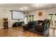 Home theater featuring a large screen, tiered seating, and game console for entertainment at 410 Waterridge Ct, Sandy Springs, GA 30350