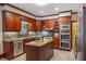 Traditional kitchen with stainless appliances, granite countertops, tile backsplash, and center island at 410 Waterridge Ct, Sandy Springs, GA 30350