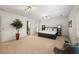 Bright and airy primary bedroom suite with a plush bed and neutral decor, leading to a spa-like bathroom at 410 Waterridge Ct, Sandy Springs, GA 30350