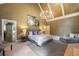 Bright main bedroom with high ceilings, neutral carpet, large bed, and decorative chandelier at 410 Waterridge Ct, Sandy Springs, GA 30350