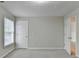 Bedroom featuring a window and neutral-toned walls and carpet at 430 Tara Oaks Ct, Lawrenceville, GA 30043