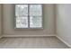 Bedroom featuring a double window and neutral-toned walls and carpet at 430 Tara Oaks Ct, Lawrenceville, GA 30043