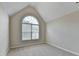 Bedroom featuring a large window and neutral-toned walls and carpet at 430 Tara Oaks Ct, Lawrenceville, GA 30043